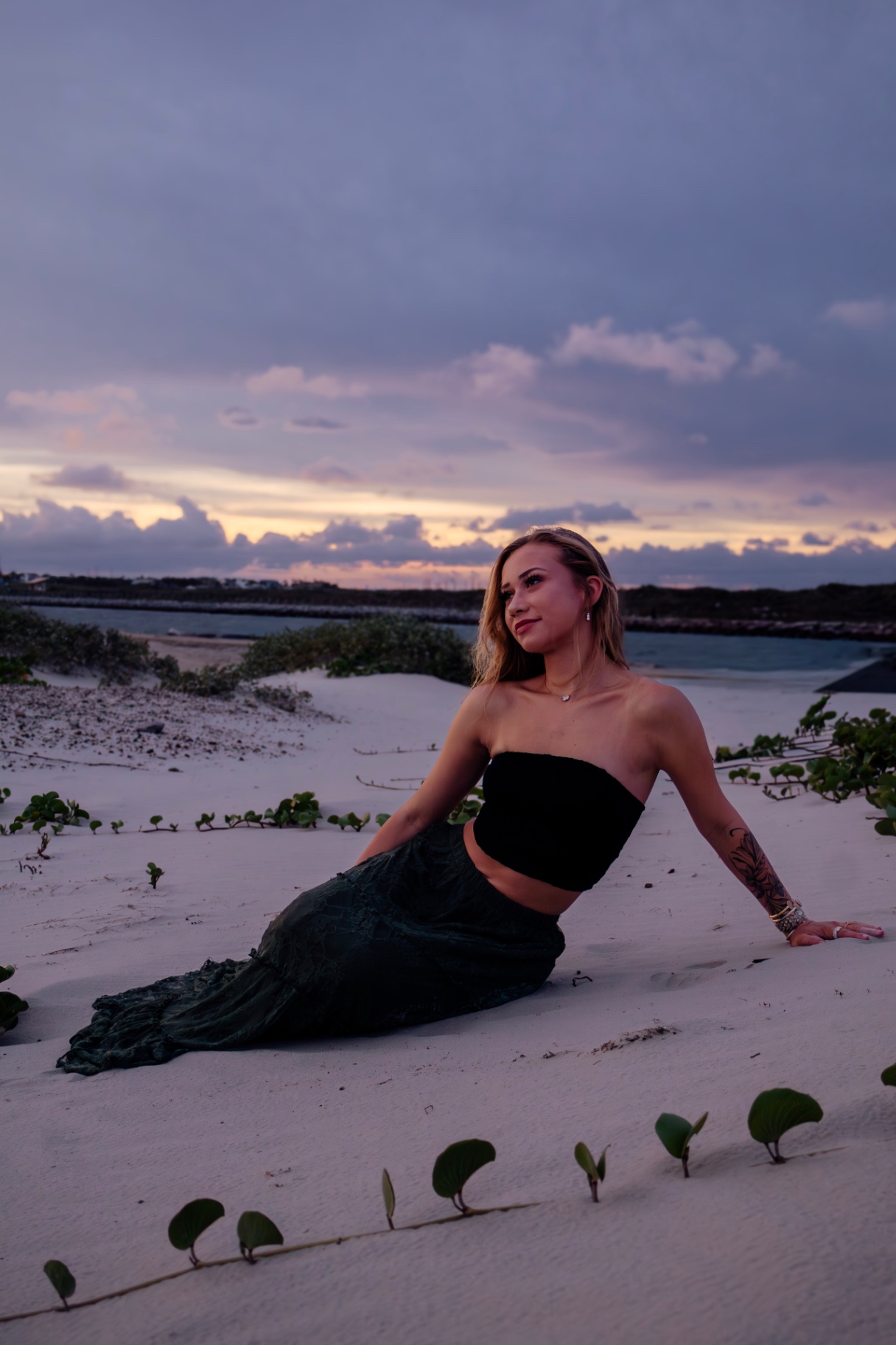 Senior portrait on the dunes at sunset